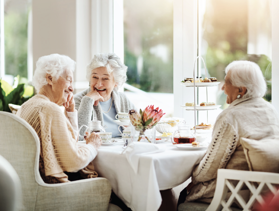 Ladies laughing and enjoying a meal together